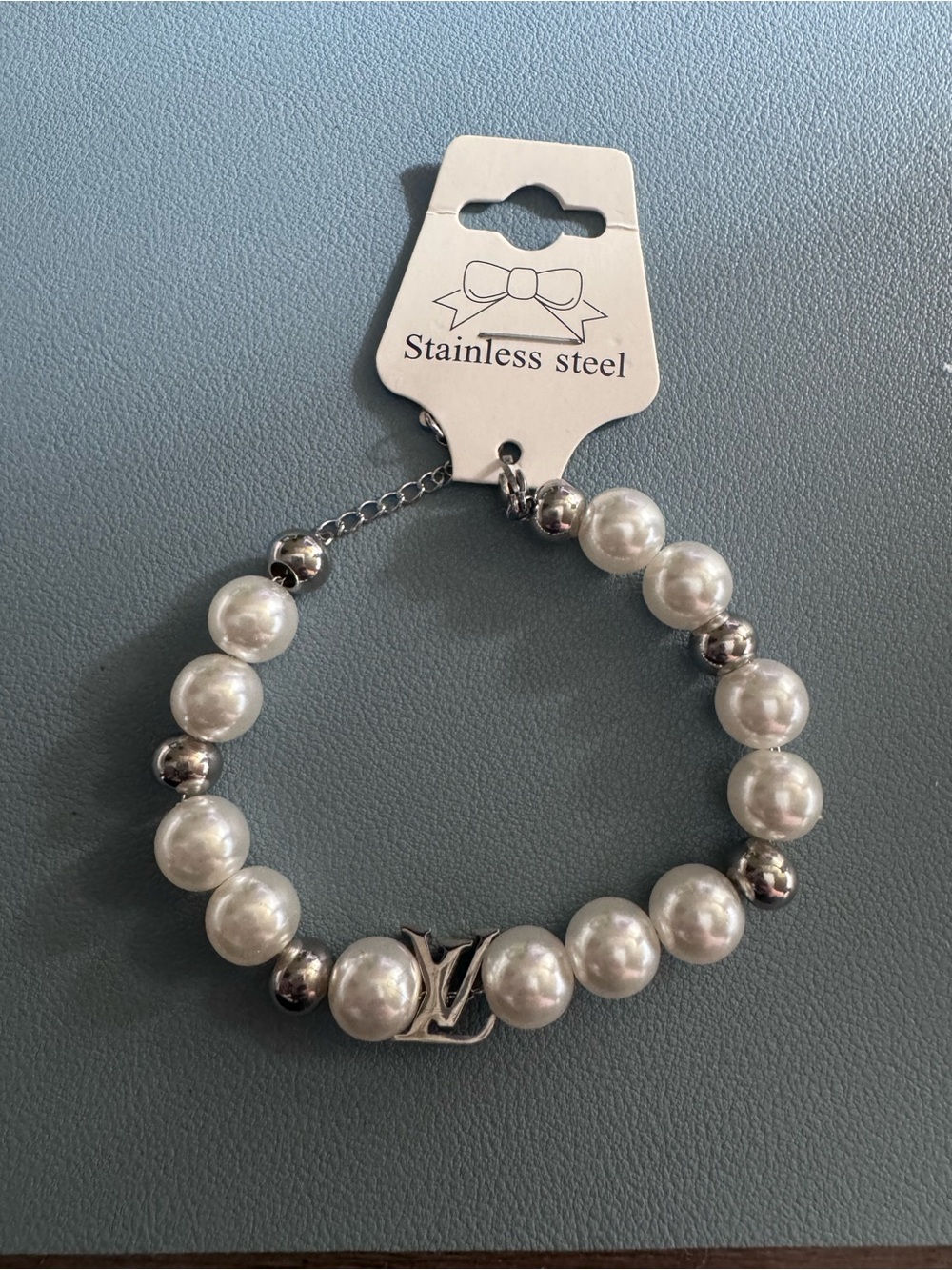 Stainless Steel White Pearl Bracelet with Logo Accent